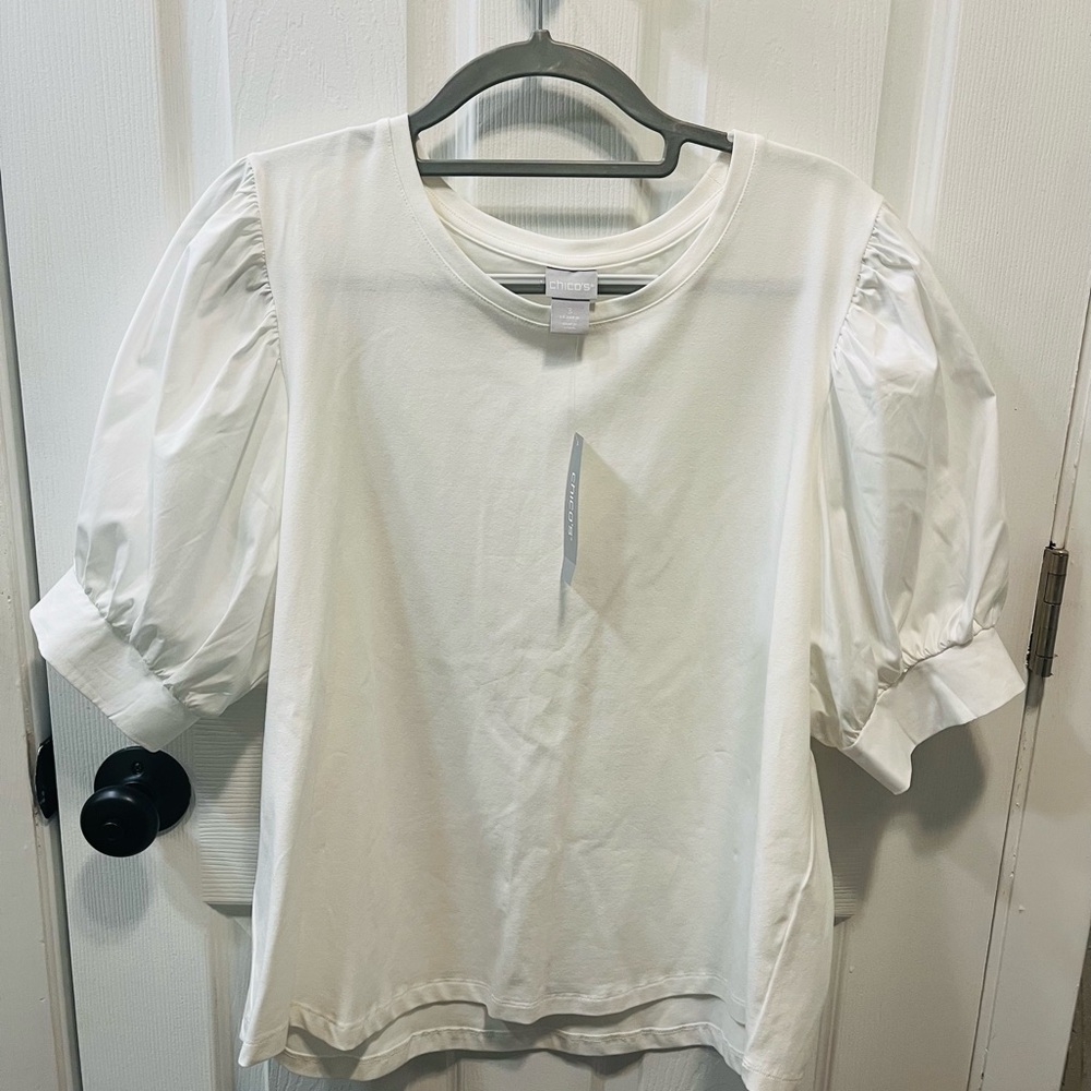 Chico’s Elegant White Puff Sleeve Top - XL - NWT
Retail 75.50.
